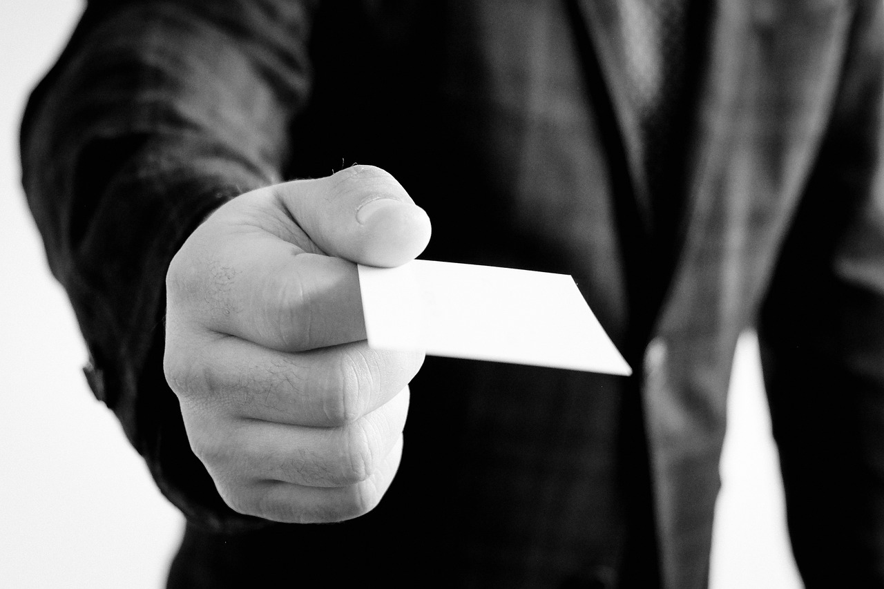 Business card, hand, jacket — Inshore Techniques That Effectively Address Your Company Database Integration Issues